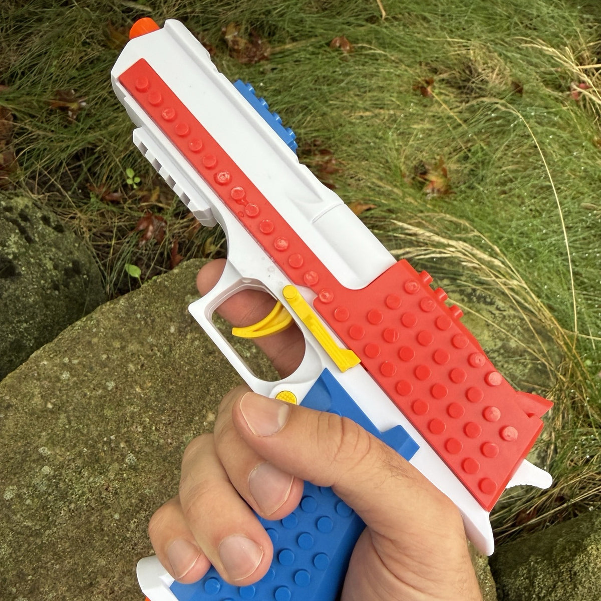 Brick Eagle building block toy pistol held in hand