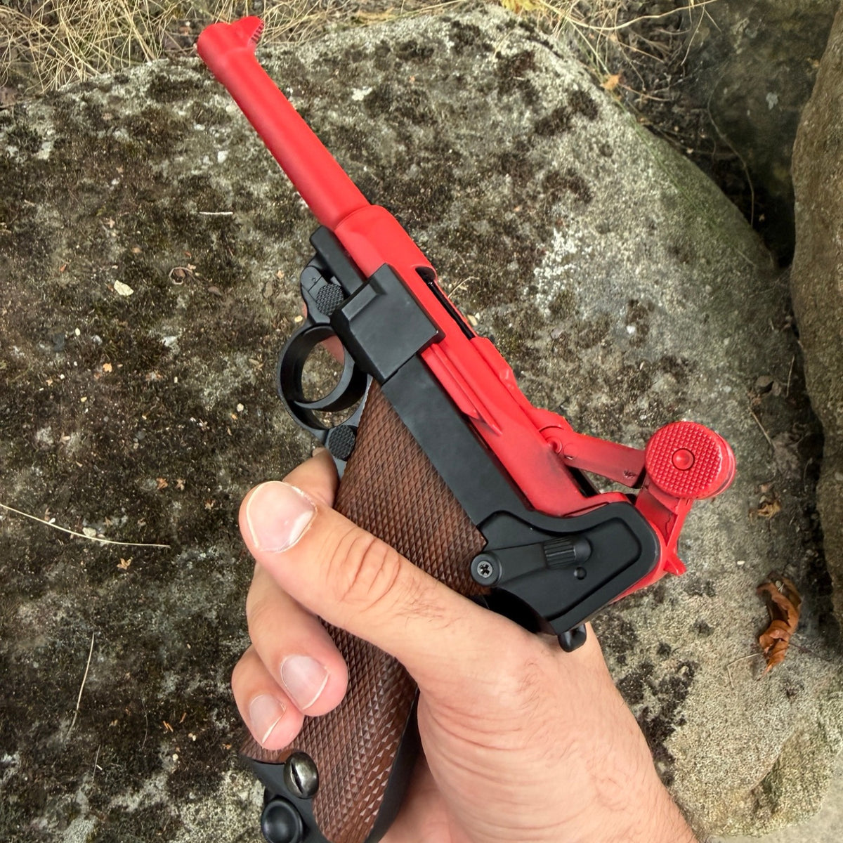 Luger P08 shell ejecting pistol prop held in hand