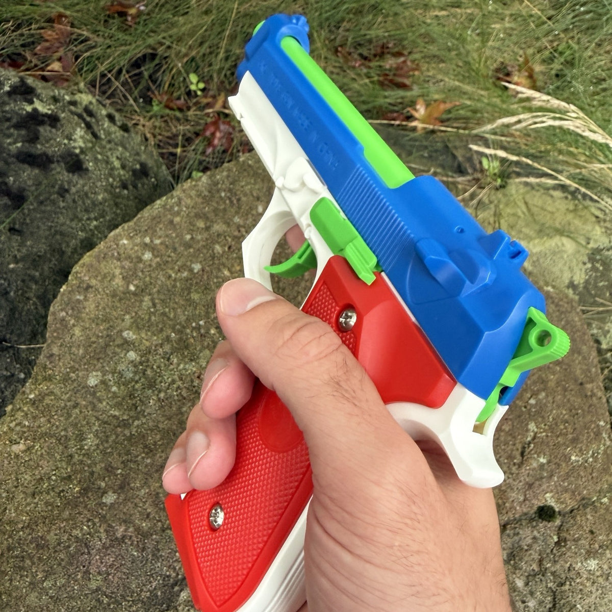 M9 Patriot Edition toy pistol held in hand